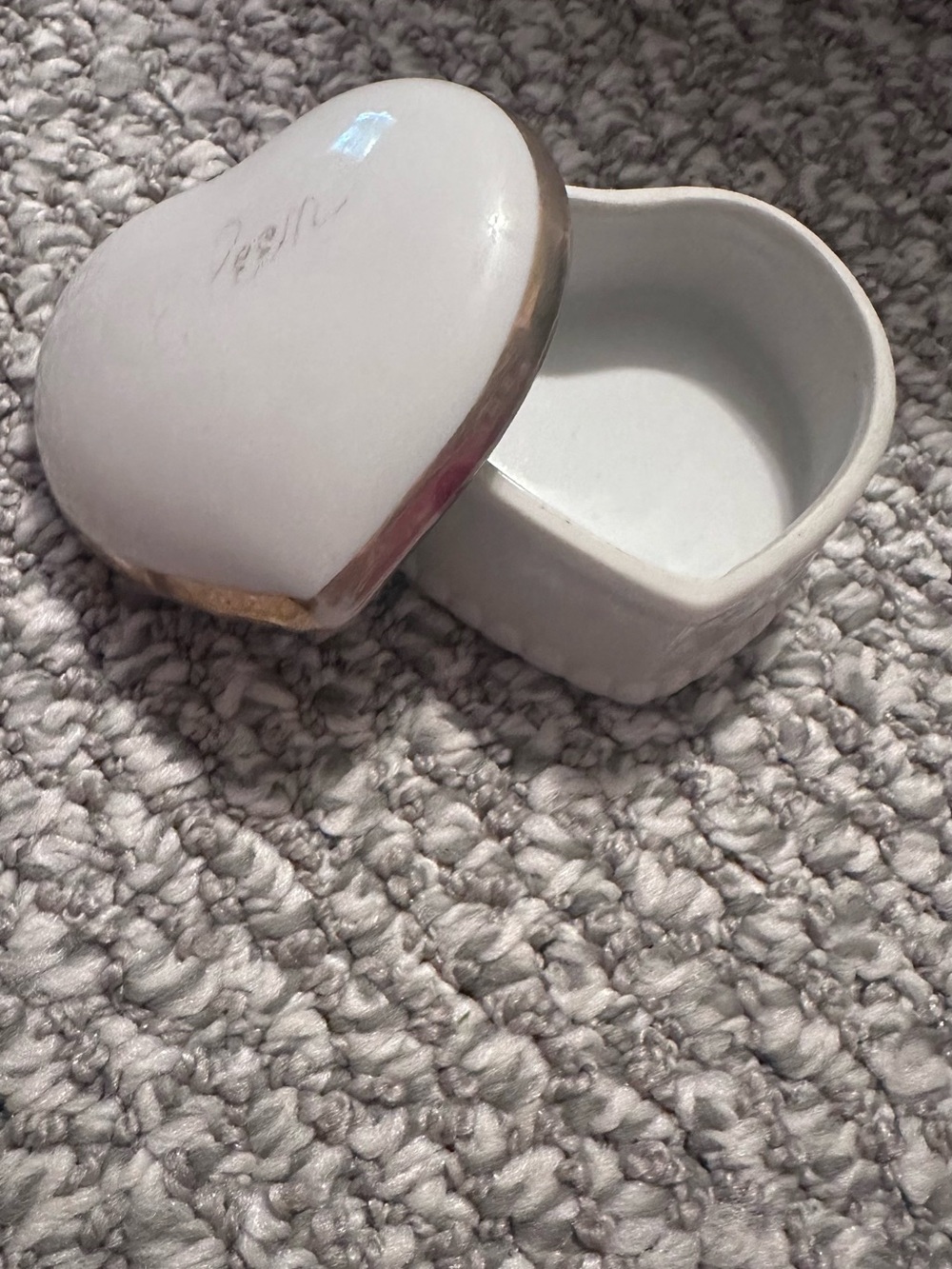 White Heart Shaped Trinket Box with gold Trim and faint lettering